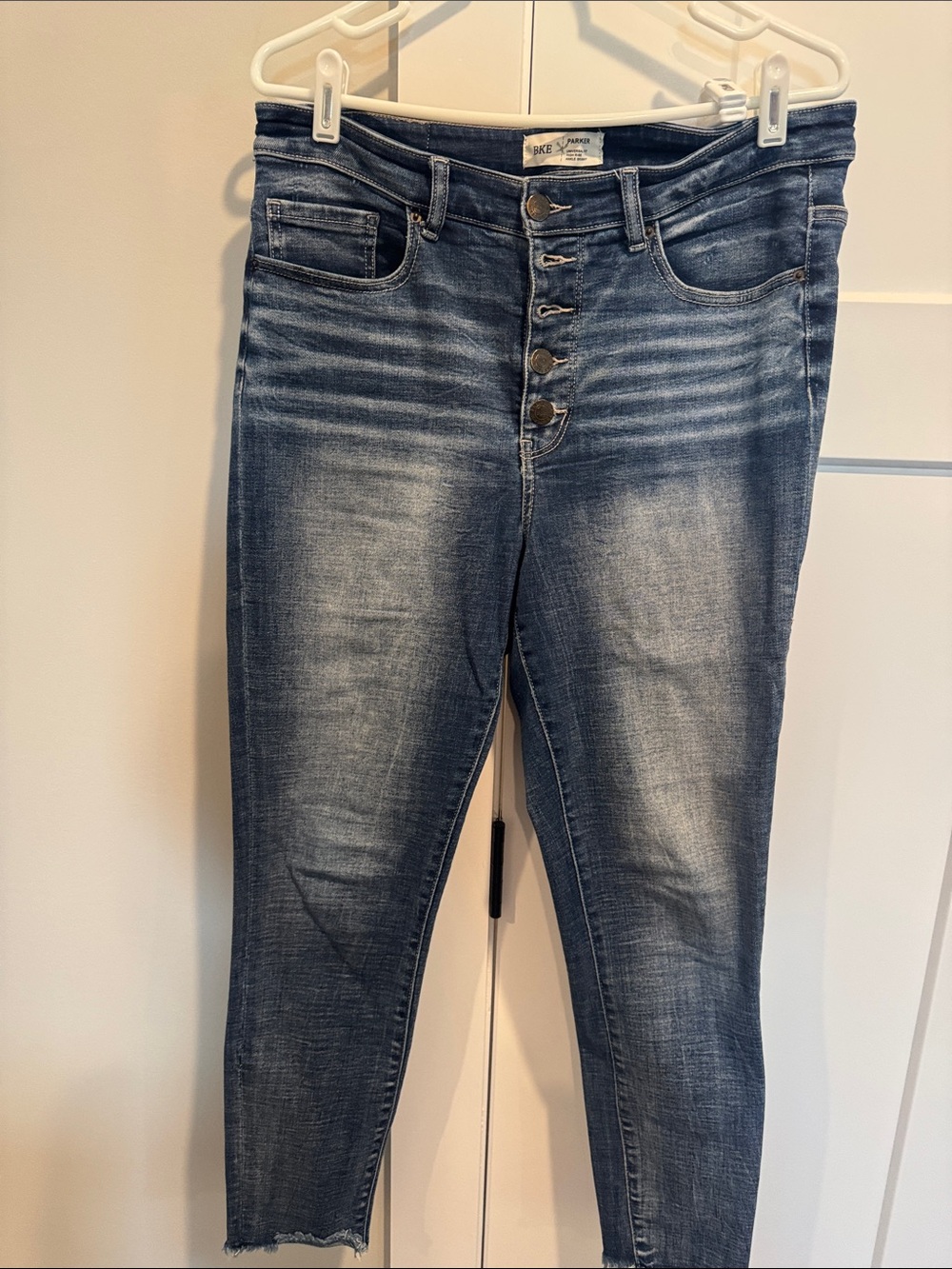 High-Rise Button-Fly Skinny Jeans in Faded Blue
